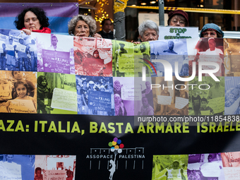 Pacifists protest against the increase in military spending and in favor of human rights in Piazza Capranica near the Chamber of Deputies Pi...