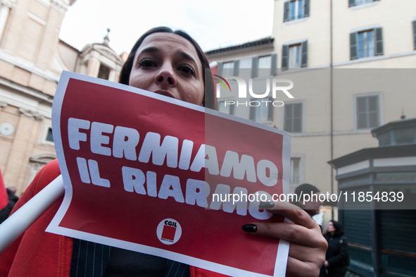 Pacifists protest against the increase in military spending and in favor of human rights in Piazza Capranica near the Chamber of Deputies Pi...