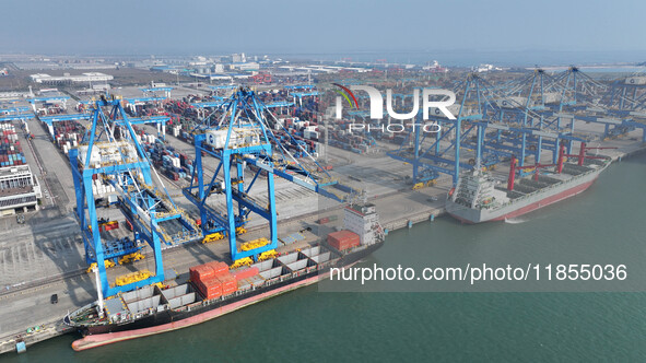 Large cargo ships are loaded at Qinzhou Automated Container Terminal in Beiwan Port, South China's Guangxi Zhuang Autonomous Region, on Dece...