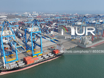 Large cargo ships are loaded at Qinzhou Automated Container Terminal in Beiwan Port, South China's Guangxi Zhuang Autonomous Region, on Dece...