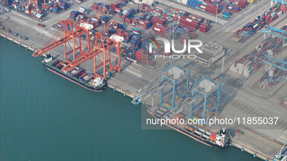 Large cargo ships are loaded at Qinzhou Automated Container Terminal in Beiwan Port, South China's Guangxi Zhuang Autonomous Region, on Dece...