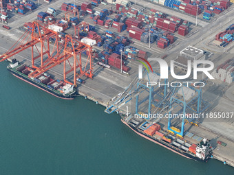 Large cargo ships are loaded at Qinzhou Automated Container Terminal in Beiwan Port, South China's Guangxi Zhuang Autonomous Region, on Dece...