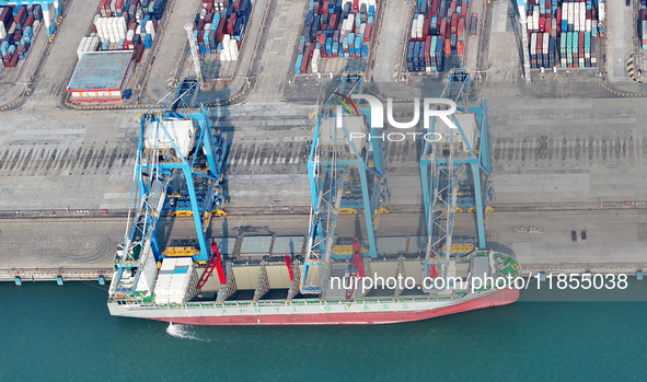 Large cargo ships are loaded at Qinzhou Automated Container Terminal in Beiwan Port, South China's Guangxi Zhuang Autonomous Region, on Dece...