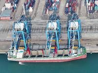 Large cargo ships are loaded at Qinzhou Automated Container Terminal in Beiwan Port, South China's Guangxi Zhuang Autonomous Region, on Dece...