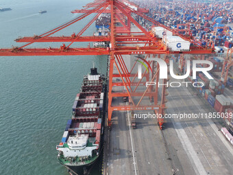 Large cargo ships are loaded at Qinzhou Automated Container Terminal in Beiwan Port, South China's Guangxi Zhuang Autonomous Region, on Dece...