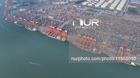 Large cargo ships are loaded at Qinzhou Automated Container Terminal in Beiwan Port, South China's Guangxi Zhuang Autonomous Region, on Dece...