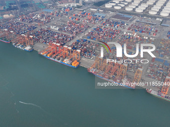 Large cargo ships are loaded at Qinzhou Automated Container Terminal in Beiwan Port, South China's Guangxi Zhuang Autonomous Region, on Dece...