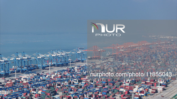 Large cargo ships are loaded at Qinzhou Automated Container Terminal in Beiwan Port, South China's Guangxi Zhuang Autonomous Region, on Dece...