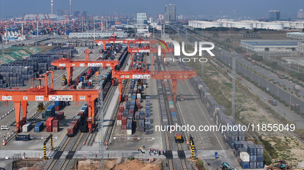 A train prepares to depart at the Qinzhou Railway Container Center station in Guangxi Zhuang Autonomous Region, China, on December 5, 2024. 