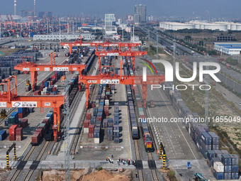 A train prepares to depart at the Qinzhou Railway Container Center station in Guangxi Zhuang Autonomous Region, China, on December 5, 2024....