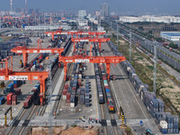 A train prepares to depart at the Qinzhou Railway Container Center station in Guangxi Zhuang Autonomous Region, China, on December 5, 2024....