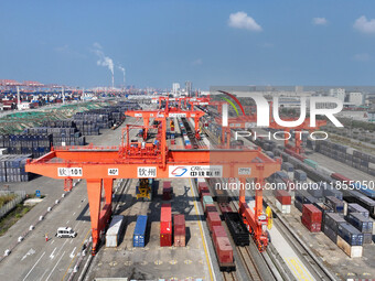 A train prepares to depart at the Qinzhou Railway Container Center station in Guangxi Zhuang Autonomous Region, China, on December 5, 2024....