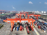 A train prepares to depart at the Qinzhou Railway Container Center station in Guangxi Zhuang Autonomous Region, China, on December 5, 2024....