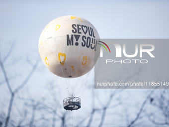 Tourists ride hot air balloons at Yeouido Park in Seoul, South Korea, on December 11, 2024. A week passes since President Yoon Suk-yeol's de...