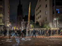 In Frankfurt am Main, Hesse, Germany, on January 1, 2024, people celebrate New Year's Eve by setting off fireworks, bangers, and firecracker...