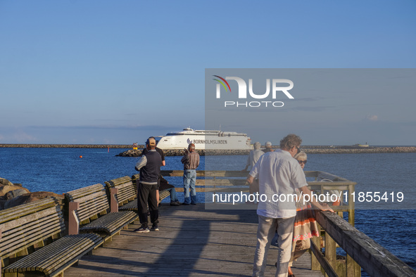 People look at the Bornholmslinjen ferry going to Bornholm Island in Ystad, Sweden, on August 4, 2024 