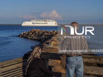 People look at the Bornholmslinjen ferry going to Bornholm Island in Ystad, Sweden, on August 4, 2024 (