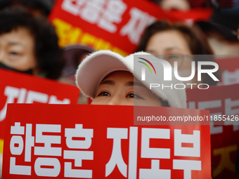 Dozens of supporters of People Power Party leader Han Dong-hoon gather for a rally in front of the party's central headquarters in Yeouido,...