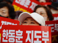 Dozens of supporters of People Power Party leader Han Dong-hoon gather for a rally in front of the party's central headquarters in Yeouido,...