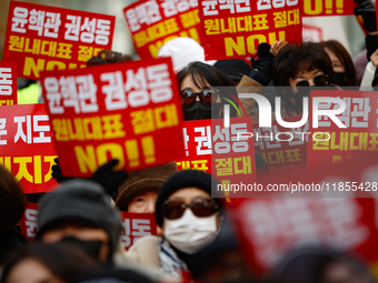 Dozens of supporters of People Power Party leader Han Dong-hoon gather for a rally in front of the party's central headquarters in Yeouido,...