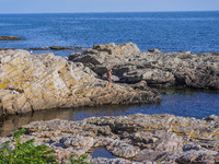 The rocky coast of the Baltic Sea is seen in Gudhjem, Bornholm Island, Denmark, on August 6, 2024 (