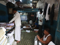 Workers make English calendars ahead of New Year 2025 at a workshop in Kolkata, India, on December 11, 2024. (