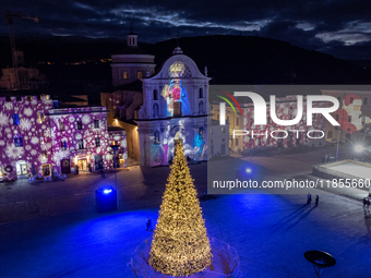 An aerial view shows Christmas lights and decorations in Piazza Duomo Square in L'Aquila, Italy, on december 10th, 2024. (