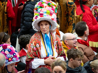 Women from a folk group wear hats with flowers as they wait for the arrival of Pope Francis during the weekly general audience at Paul-VI ha...