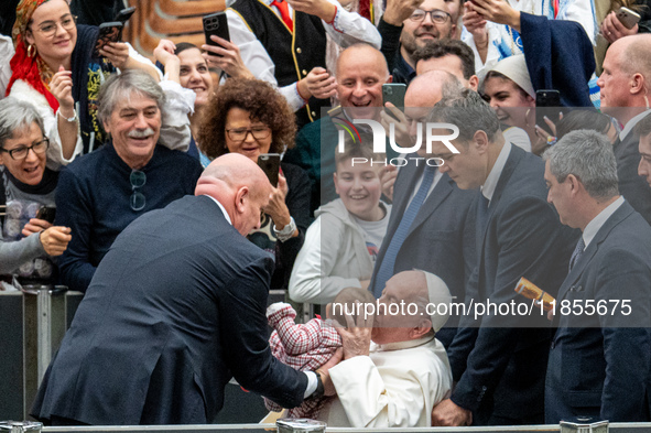 Pope Francis greets people at the end of the weekly general audience at Paul-VI hall in The Vatican, on December 11, 2024. 