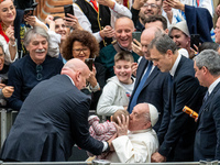 Pope Francis greets people at the end of the weekly general audience at Paul-VI hall in The Vatican, on December 11, 2024. (