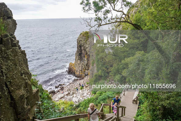 People visit Jons Kapel cliff near Hasle on Bornholm Island in Denmark on August 5, 2024. 