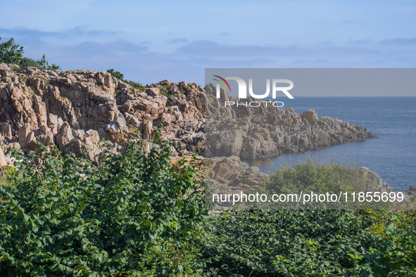 A general view of the rocky coast of the Baltic Sea in Gudhjem, Bornholm Island, Denmark, on August 6, 2024 