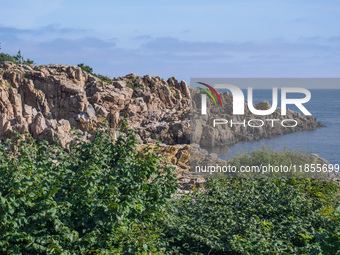 A general view of the rocky coast of the Baltic Sea in Gudhjem, Bornholm Island, Denmark, on August 6, 2024 (