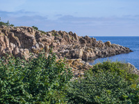 A general view of the rocky coast of the Baltic Sea in Gudhjem, Bornholm Island, Denmark, on August 6, 2024 (