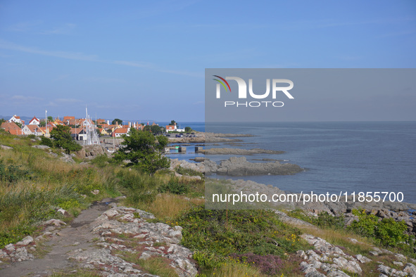 A general view of the rocky coast of the Baltic Sea in Gudhjem, Bornholm Island, Denmark, on August 6, 2024 