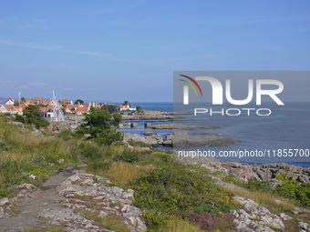 A general view of the rocky coast of the Baltic Sea in Gudhjem, Bornholm Island, Denmark, on August 6, 2024 (