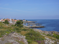 A general view of the rocky coast of the Baltic Sea in Gudhjem, Bornholm Island, Denmark, on August 6, 2024 (