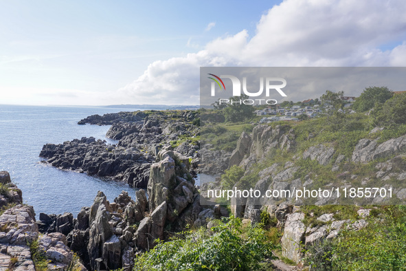 A general view of the rocky coast of the Baltic Sea in Gudhjem, Bornholm Island, Denmark, on August 6, 2024 