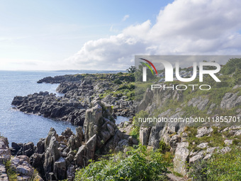 A general view of the rocky coast of the Baltic Sea in Gudhjem, Bornholm Island, Denmark, on August 6, 2024 (