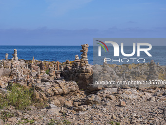 A general view of the rocky coast of the Baltic Sea in Gudhjem, Bornholm Island, Denmark, on August 6, 2024 (