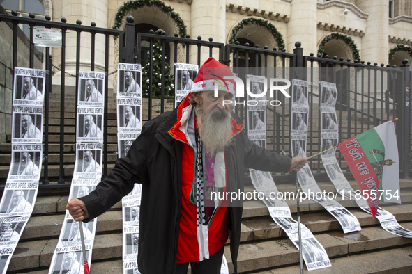 A lone protester stands against former Prime Minister Boyko Borisov, who served between 2009 and 2021 and is the leader of the party GERB (C...