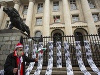 A lone protester stands against former Prime Minister Boyko Borisov, who served between 2009 and 2021 and is the leader of the party GERB (C...