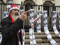 A lone protester stands against former Prime Minister Boyko Borisov, who served between 2009 and 2021 and is the leader of the party GERB (C...