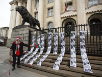 A lone protester stands against former Prime Minister Boyko Borisov, who served between 2009 and 2021 and is the leader of the party GERB (C...