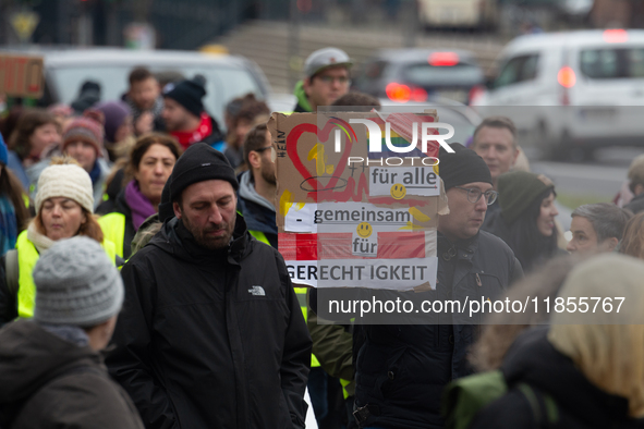 Thousands of public sector workers from several non-public organizations, German labor unions, and care day workers march for better pay and...