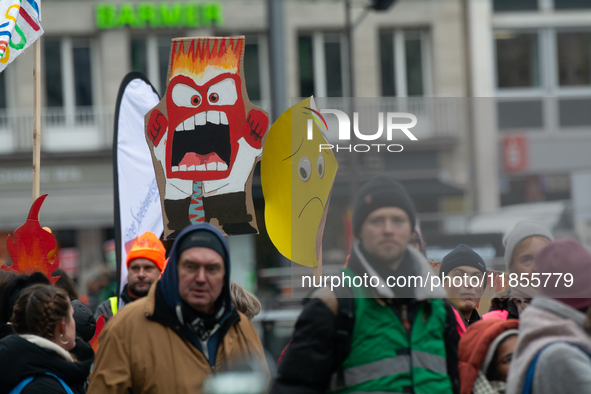 Thousands of public sector workers from several non-public organizations, German labor unions, and care day workers march for better pay and...