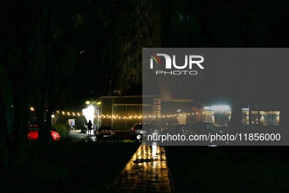 String lights illuminate a street in the Rusanivka neighborhood during a power cut in Kyiv, Ukraine, on December 7, 2024. 