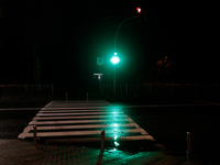 A traffic light turns green at a zebra crossing in the dark in the Rusanivka neighborhood during a power cut in Kyiv, Ukraine, on December 7...