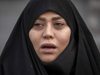 A veiled Iranian woman shouts slogans while participating in a rally to support the Hijab bill outside the Iranian Parliament building in Te...