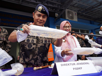 The Director General of Marine Resources and Fisheries Supervision (PSDKP), Pung Nugroho Saksono, gives a press statement while showing evid...